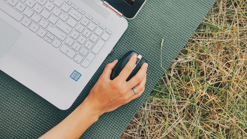 person holding computer mouse