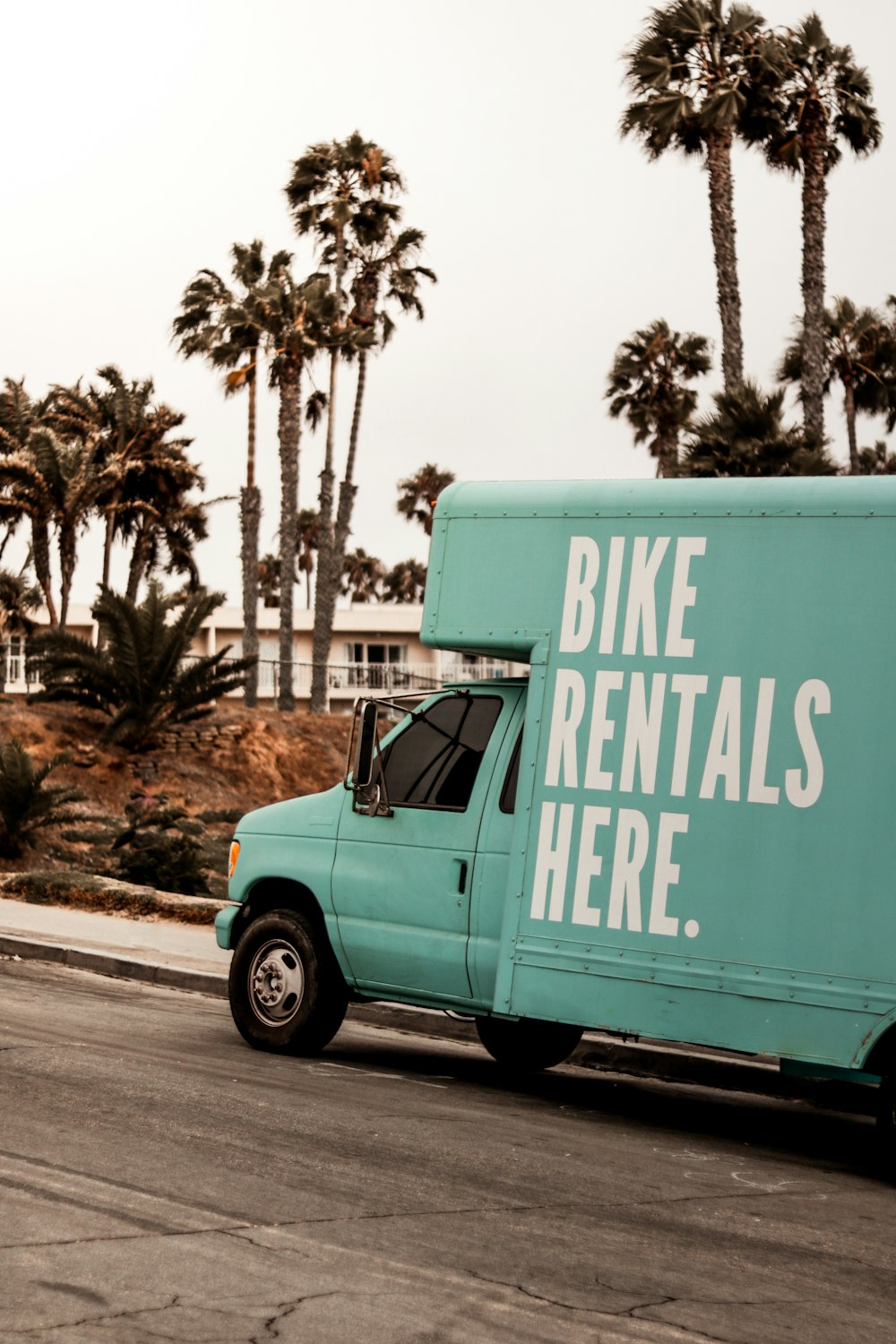 teal Bike Rentals Here. utility van