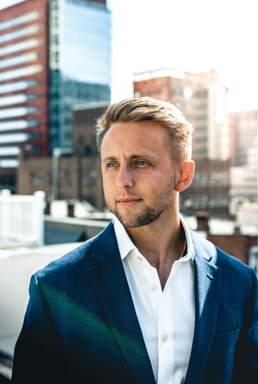 shallow focus photo of man in black suit jacket