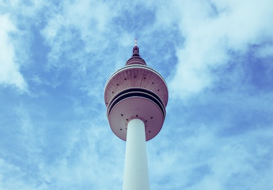 worm's eye view of white tower in Restaurant Rosenhof Germany