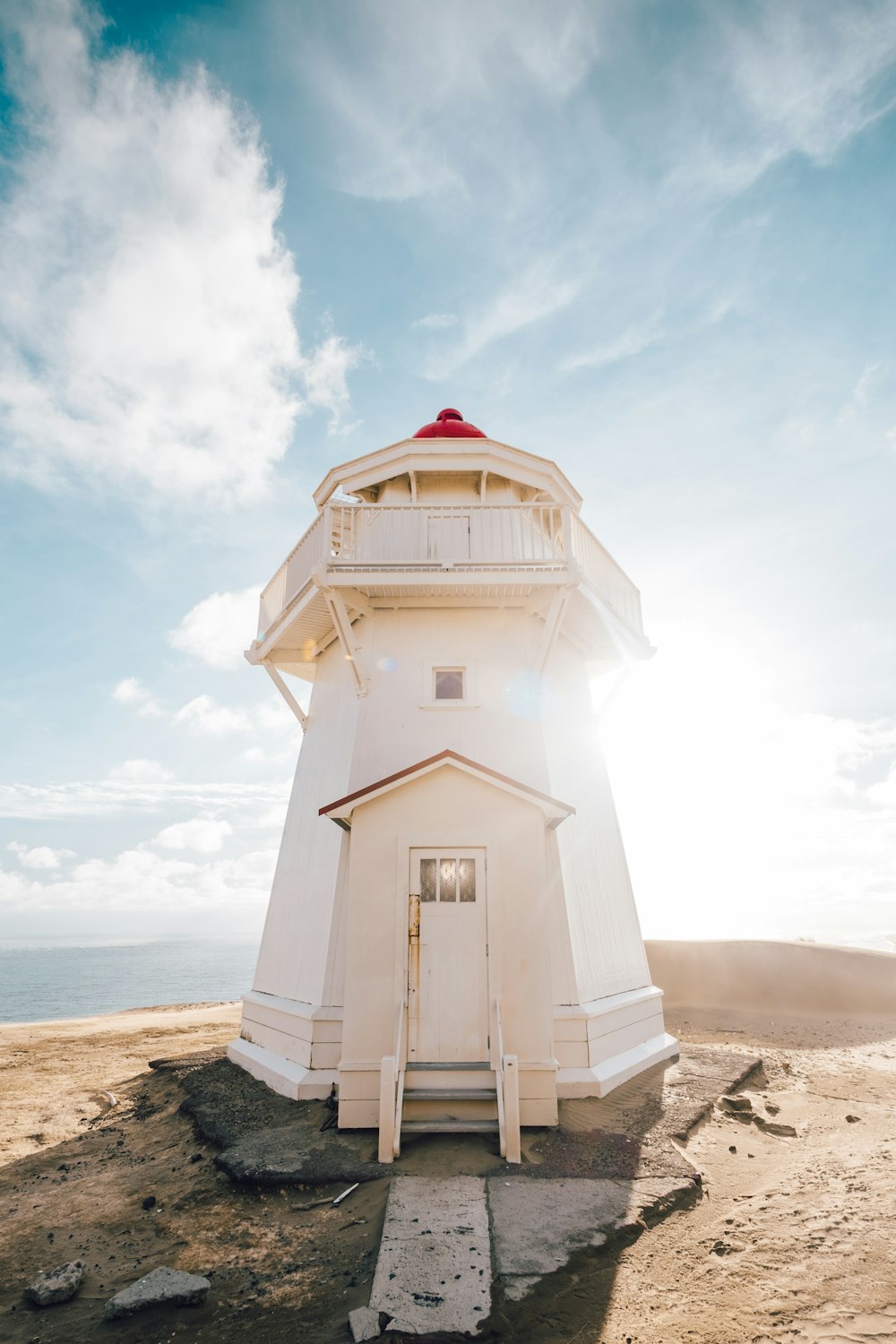 white light tower under blue sky