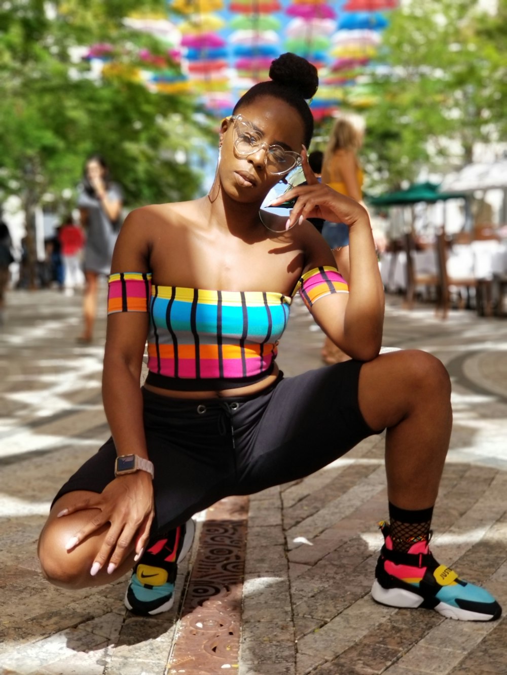 woman sitting on ground at daytime in selective focus photography