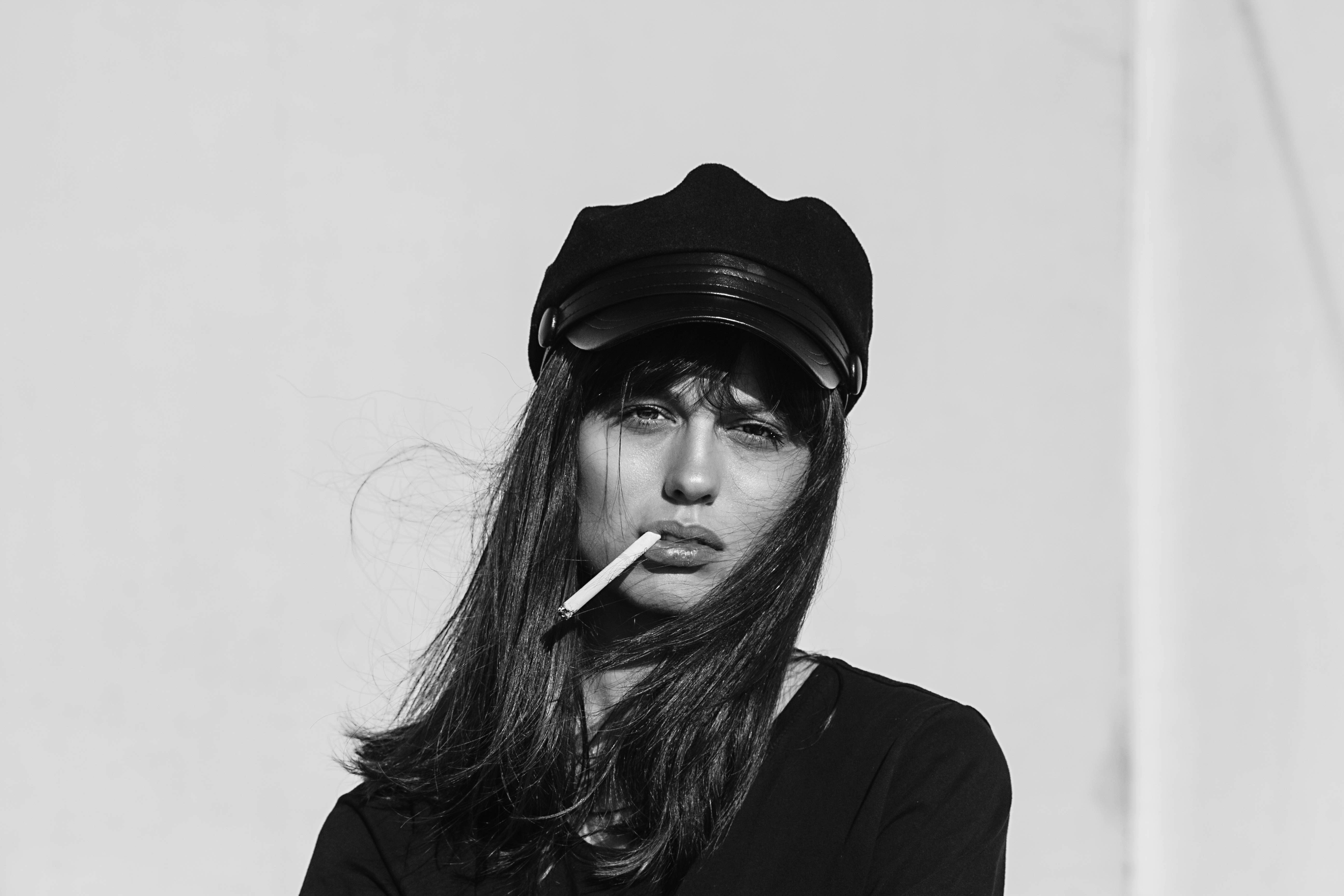 grayscale photo of woman smoking