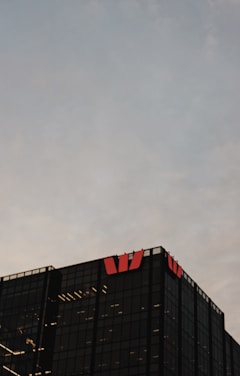 Modern corporate office building with Viacom 18 branding under a moody sky.