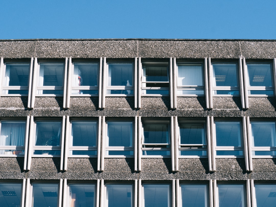 gray and white building with glass window