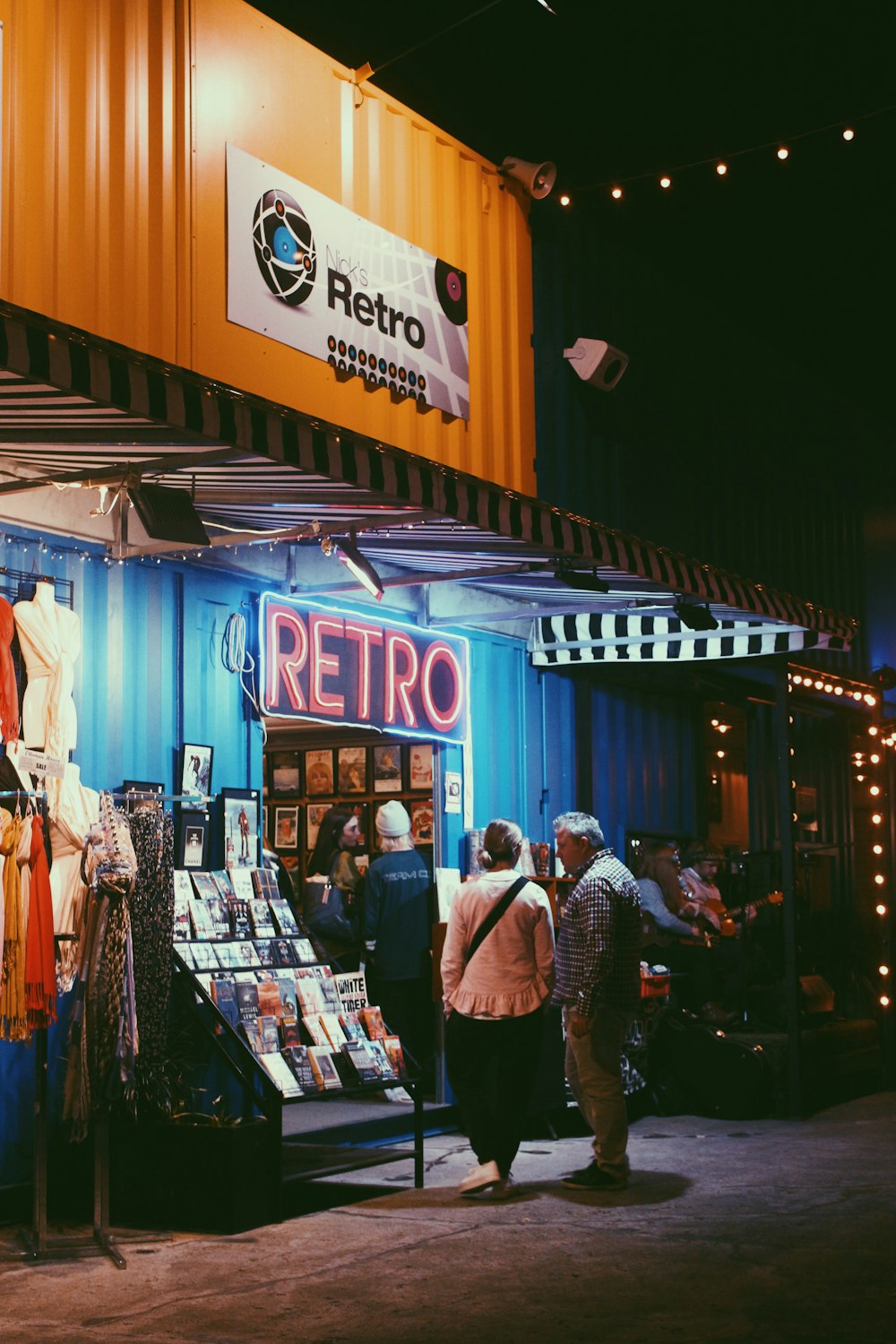 people standing beside retro building