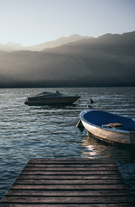 two gray boats on body of water in Lake Garda Italy