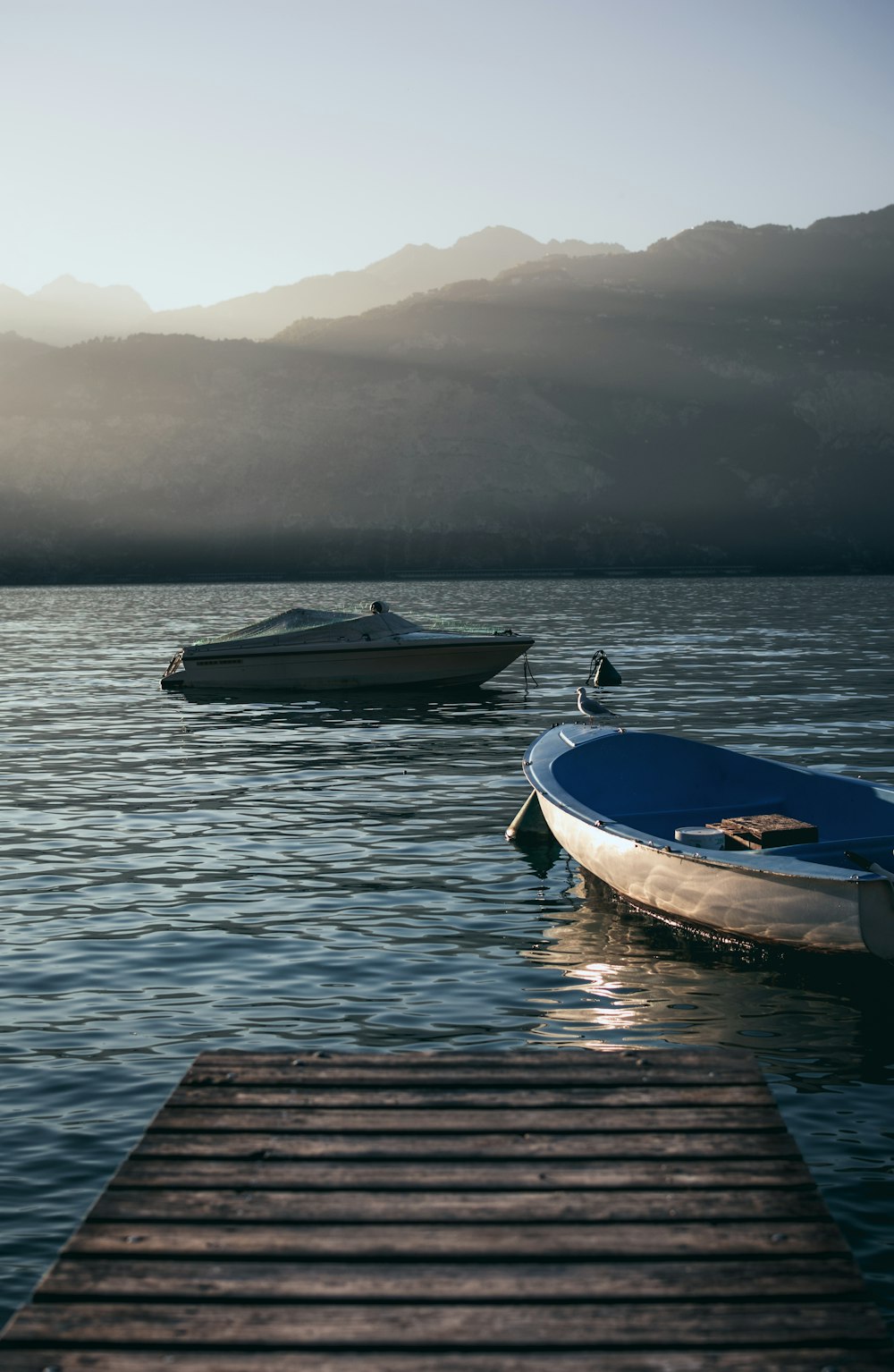 two gray boats on body of water