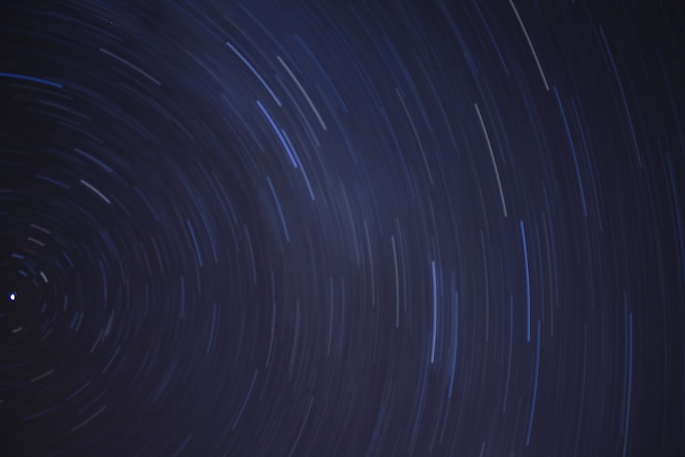 a star trail is seen in the night sky