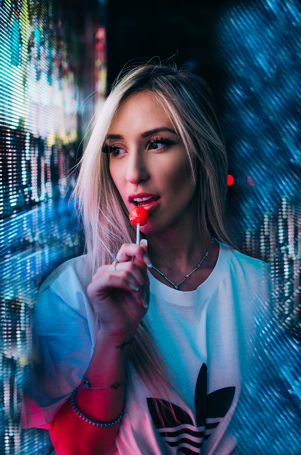 woman holding lolipop