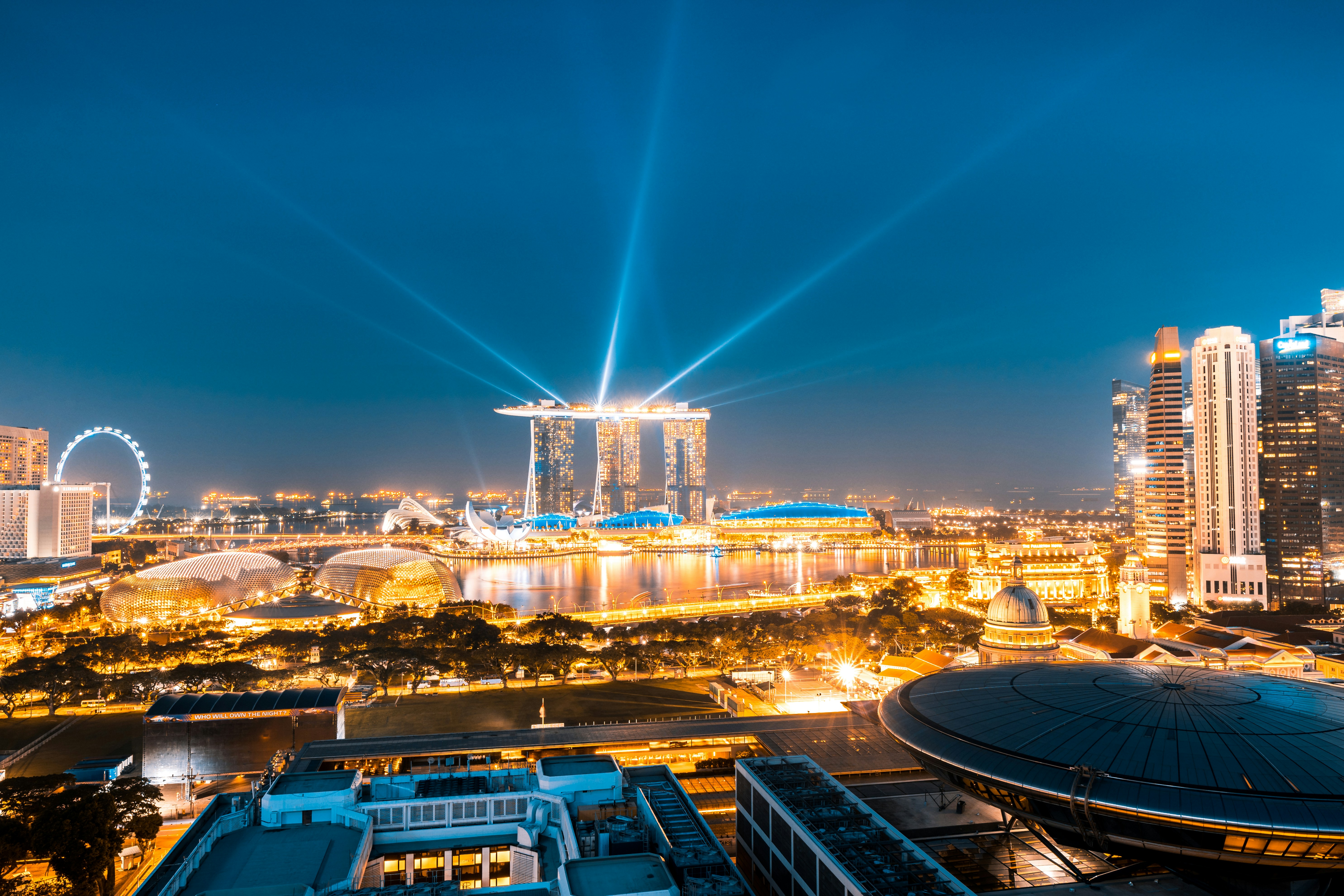 Singapore city skyline at night with modern buildings and lights
