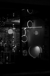 A designer sketch and mood board featuring lighting concepts in silver and black tones.