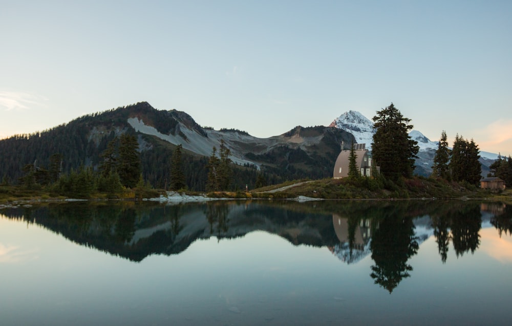 panoramic photography of mountain near lake during daytime