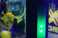 Close-up of a snack claw crane machine stocked with popular snacks and treats.