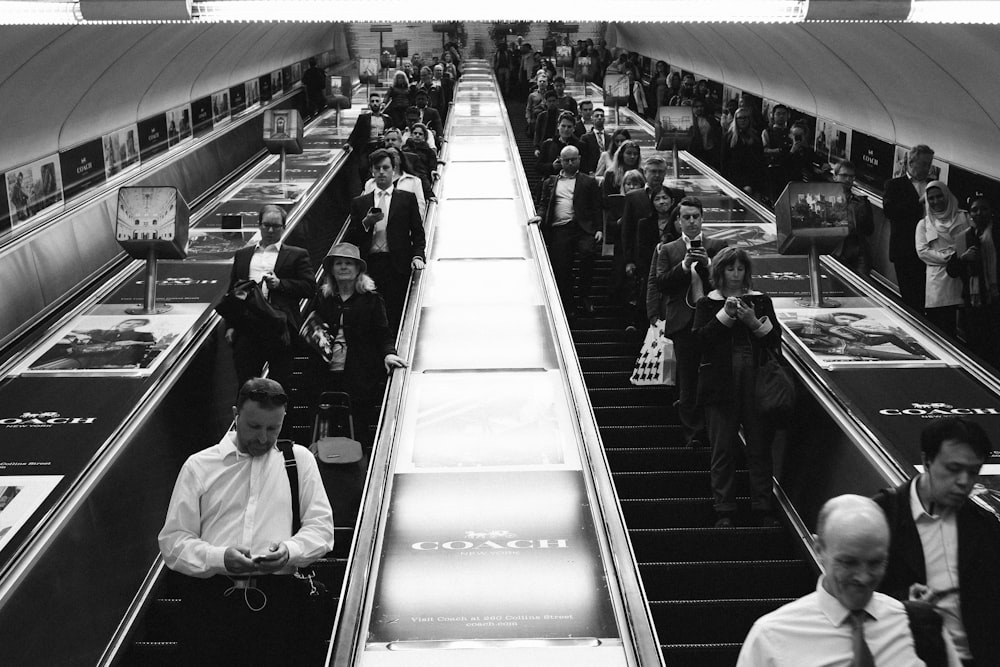 grayscale photograph of people inside structure