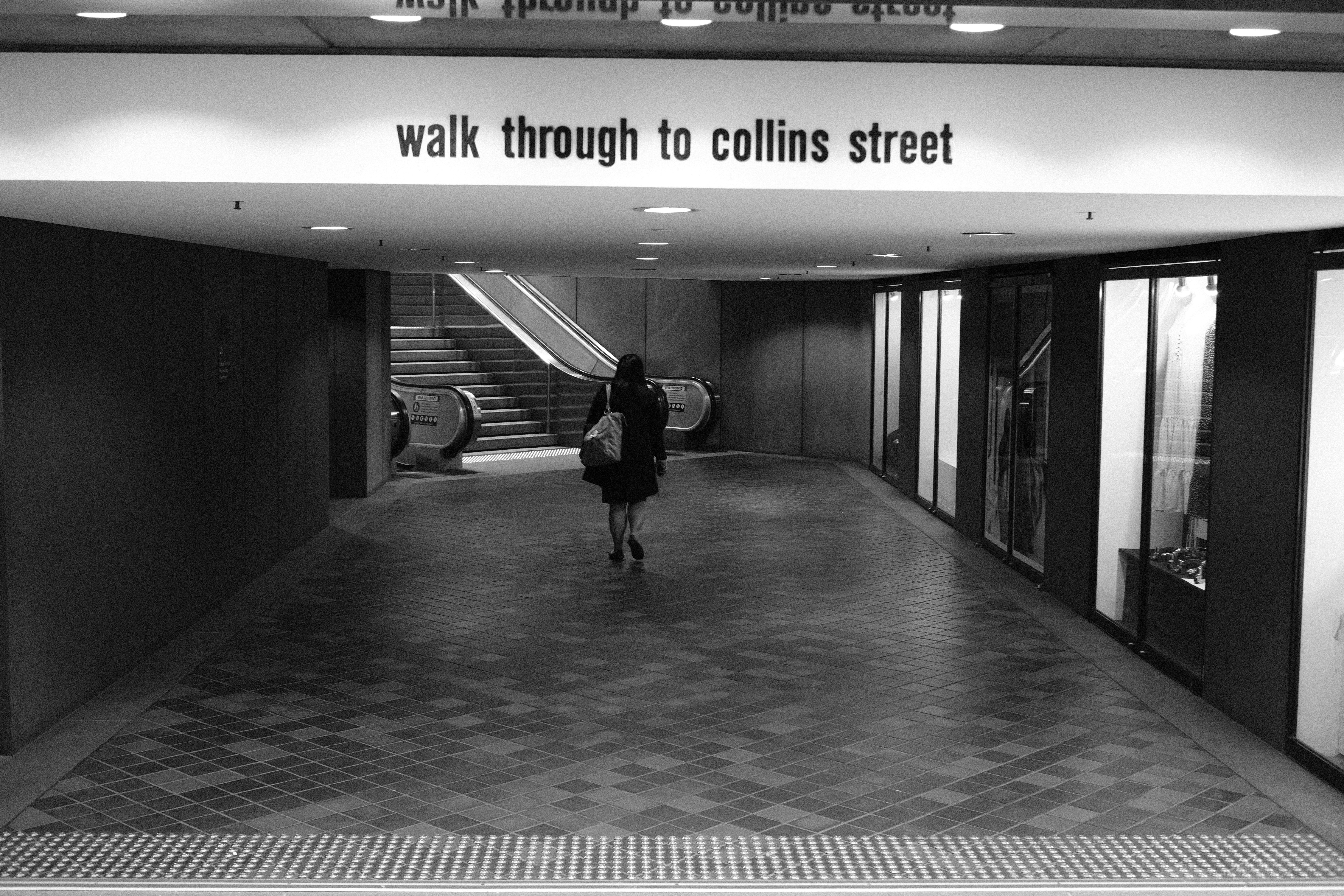 Underground walkway signposted to Collins Street