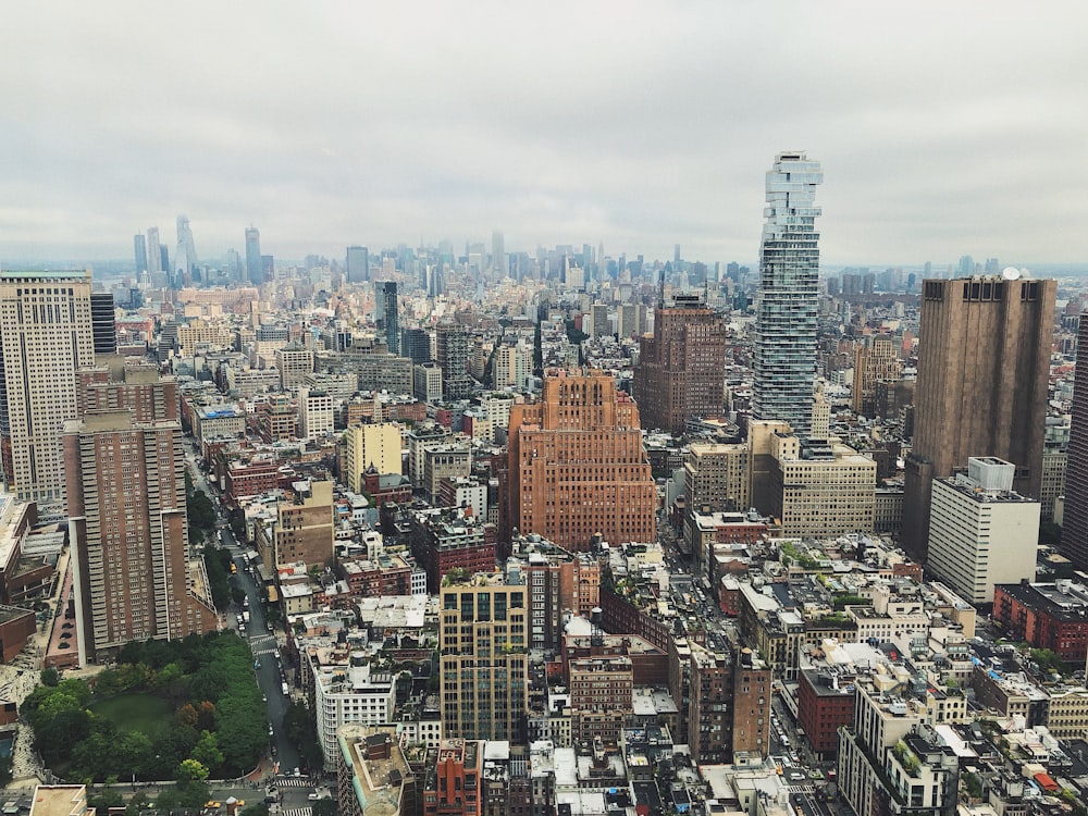 city with high-rise buildings under white skies