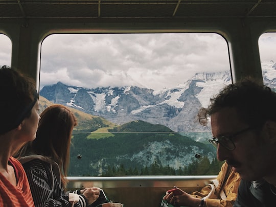 four person sitting inside vehicle in Jungfrau Switzerland