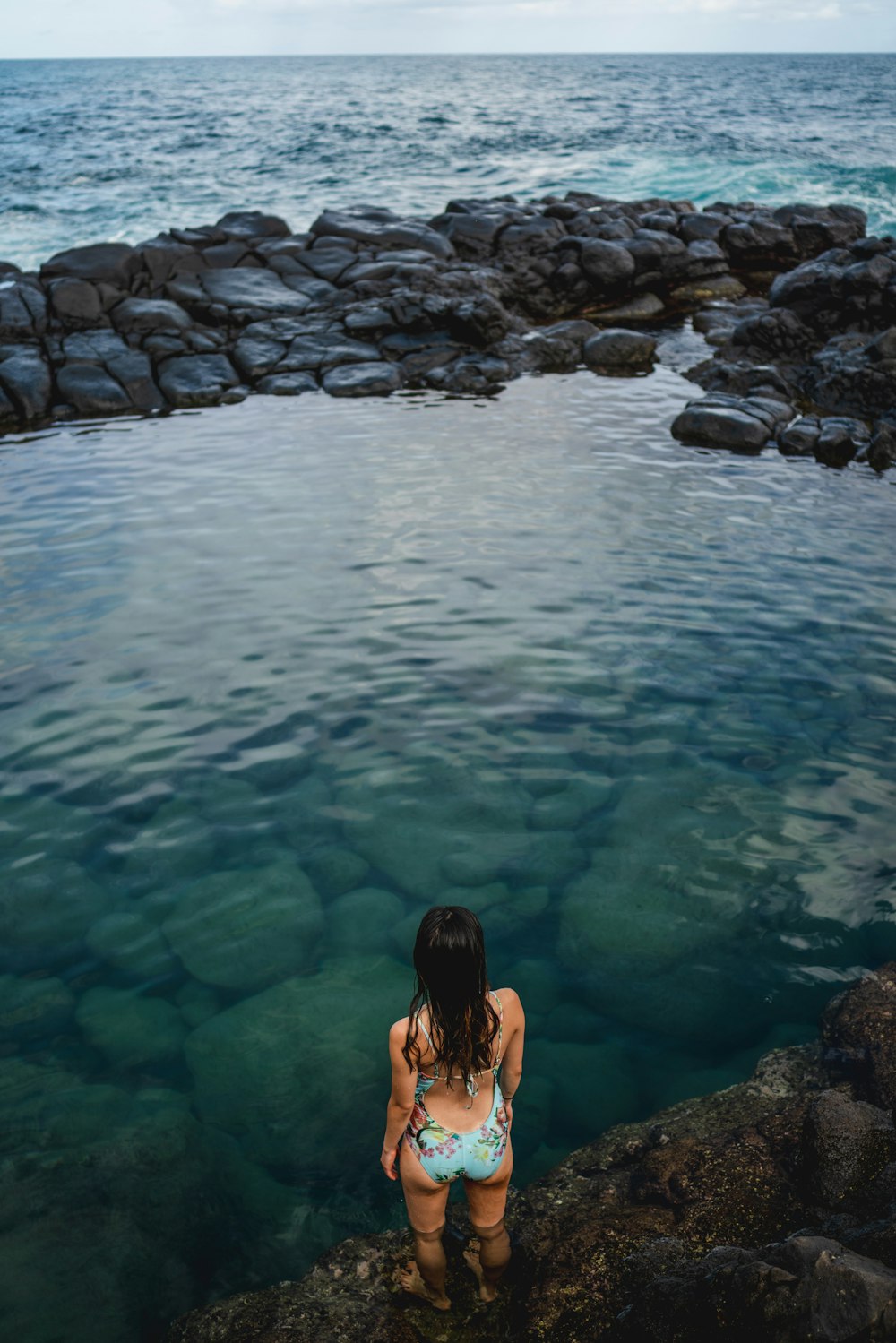 woman standing in body of water