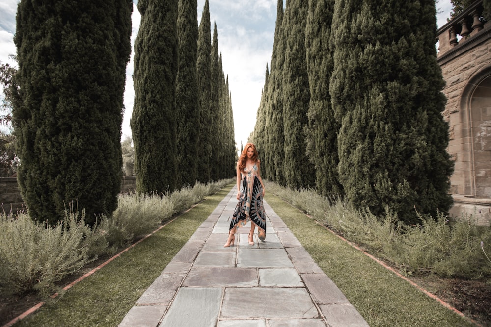 woman standing gray concrete pathway