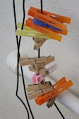 An assortment of stainless steel clothespins in various positions.