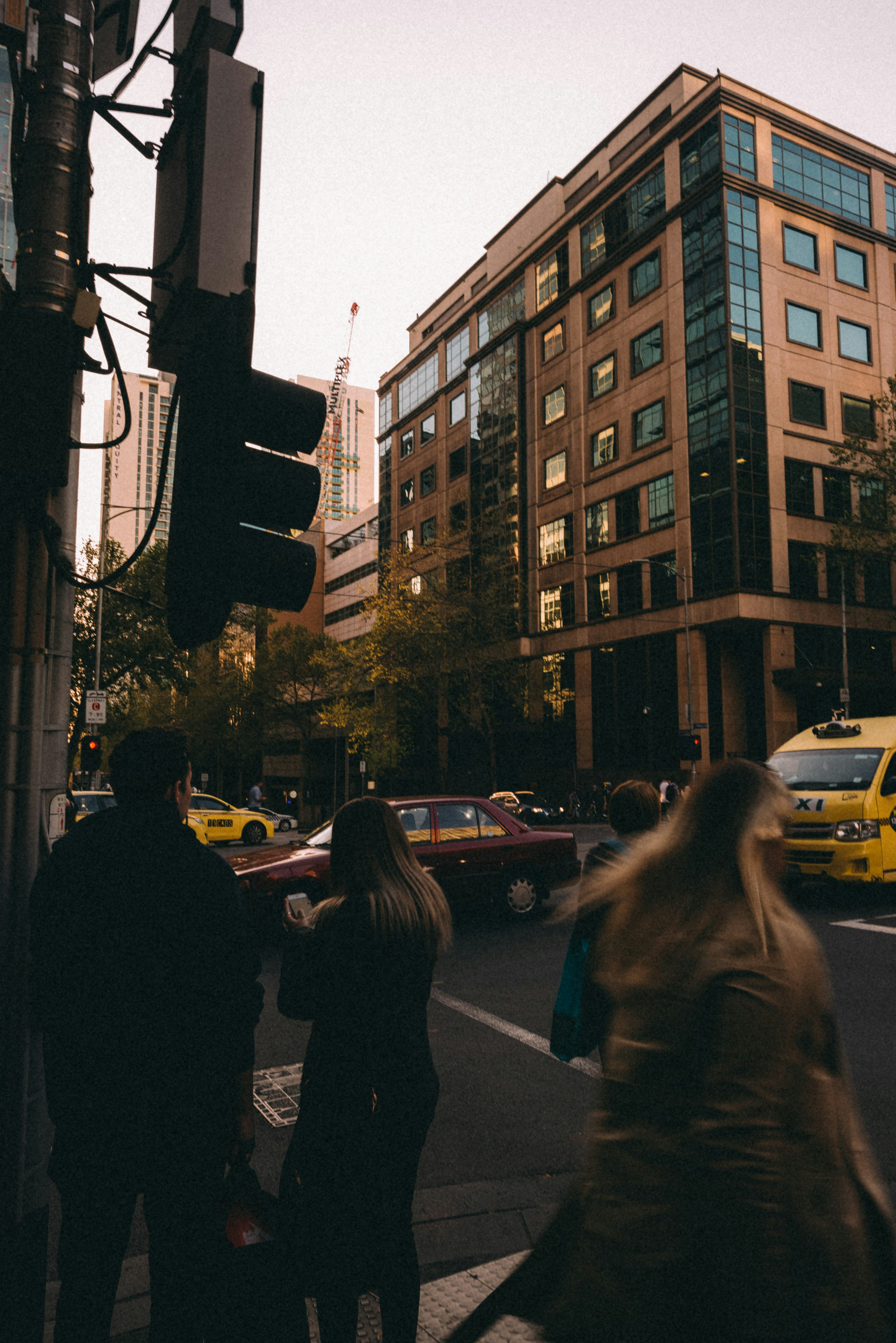 woman standing in front of traffic light