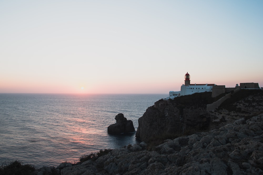 lighthouse by the sea during golden hour