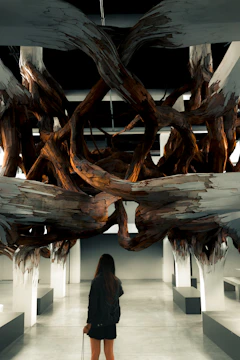 A large-scale wooden structure sculpture displayed in a New York City gallery.