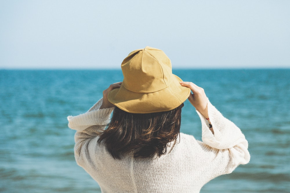 woman standing front of sea at daytime