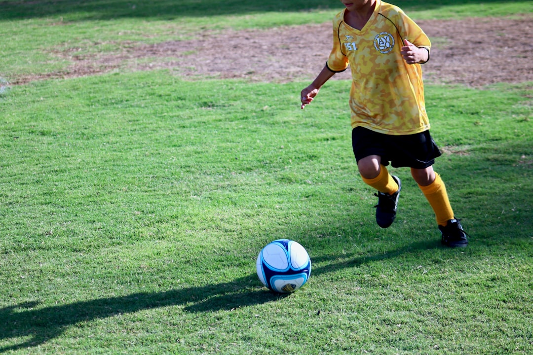 boy playing soccer