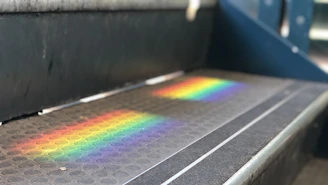 Close-up of a textured Gripaura non-slip bath mat in a bright bathroom setting.