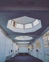 Wide shot of the studio showing minimalist design with sky-blue accents and natural textures.