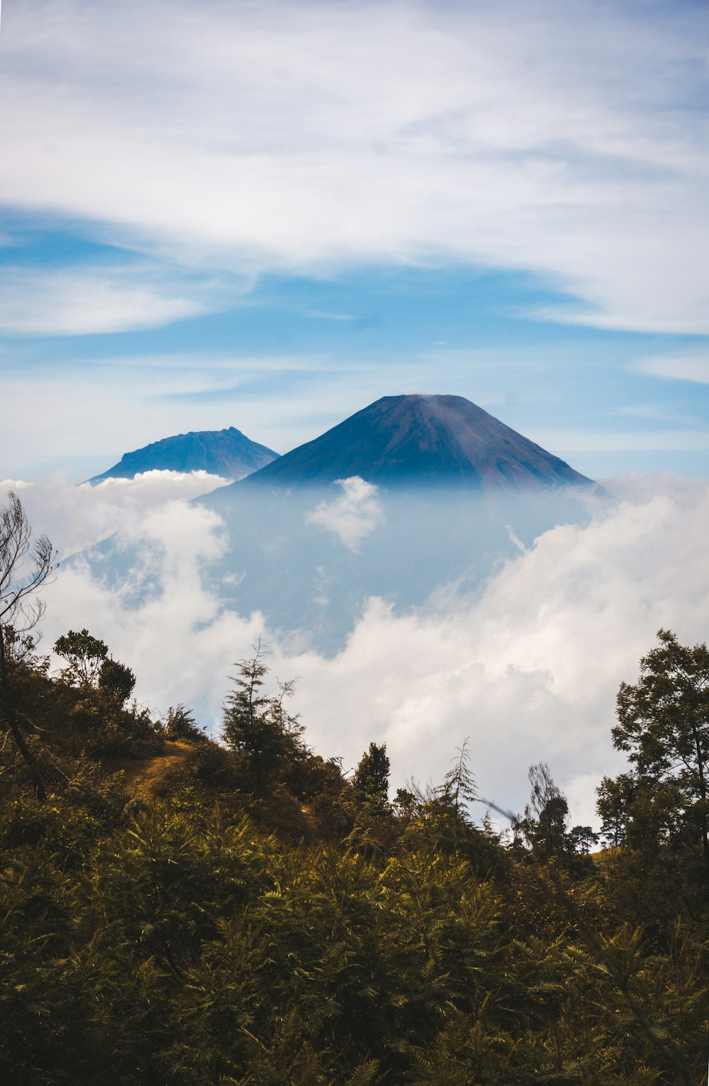 mountain with white clouds during daytime