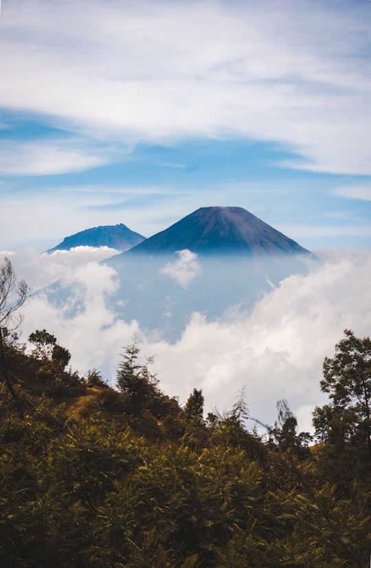 mountain with white clouds during daytime in Wonosobo Indonesia