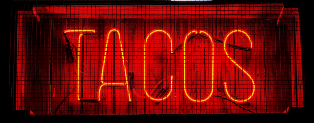 red TACOS LED signage