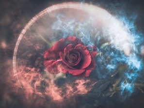 A smoky, mystical scene with a red veil being lifted, revealing a glowing heart beneath, symbolizing hope and love restored.