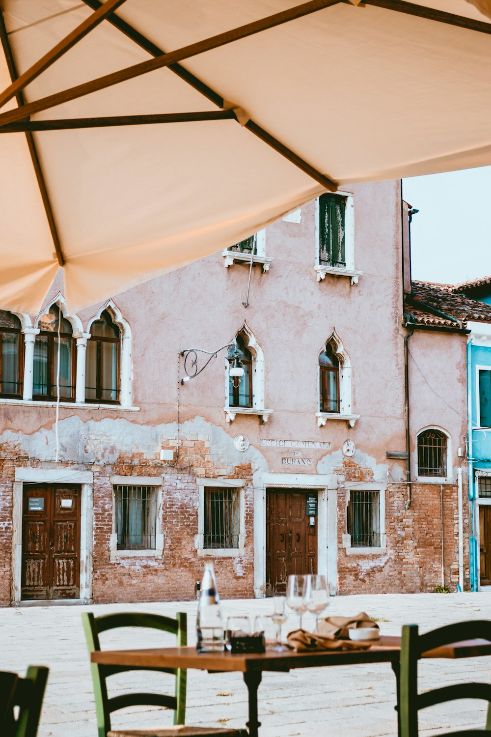 beige patio umbrella during daytime