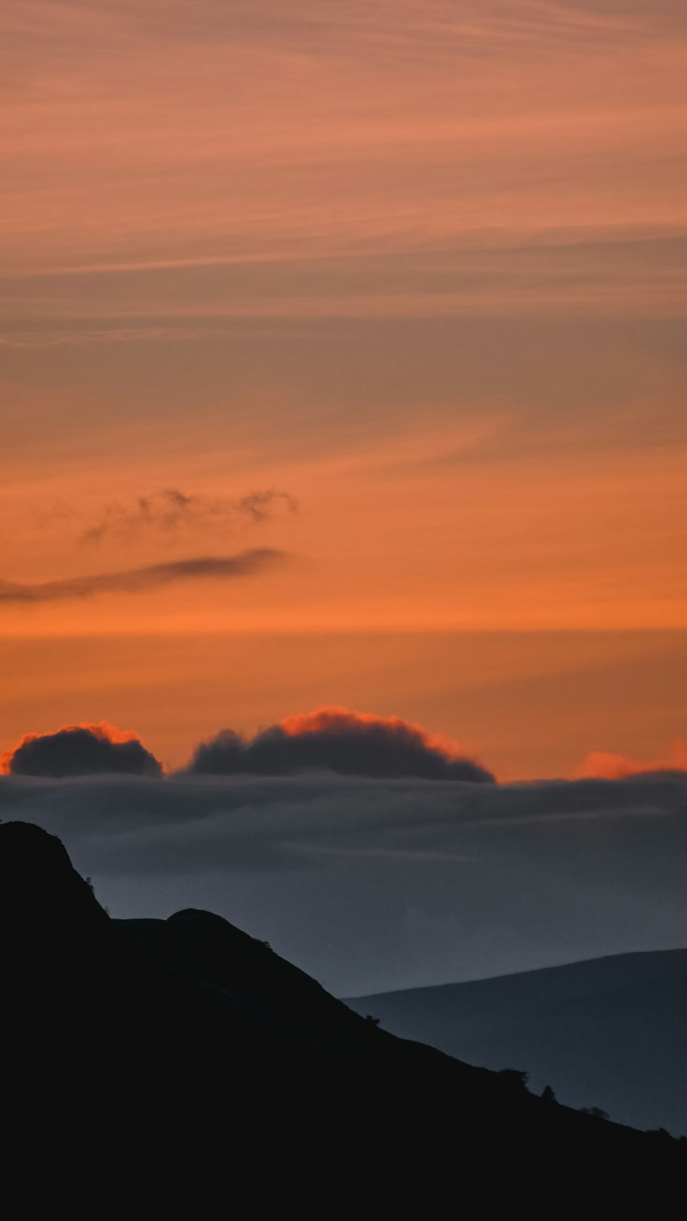 black mountain under white sky