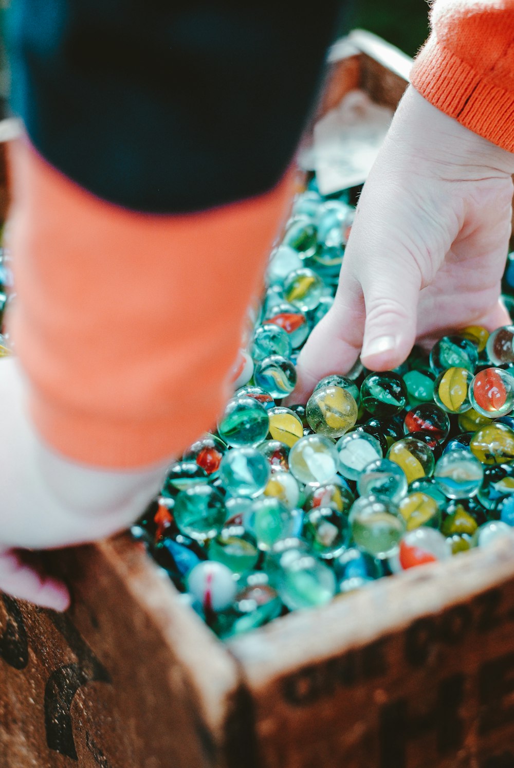 person holding marble lot