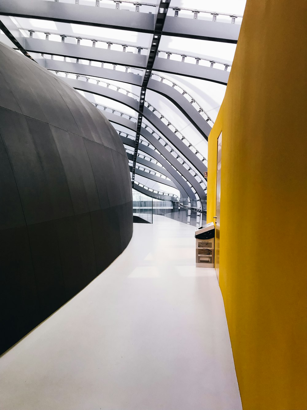 hallway between yellow and black walls