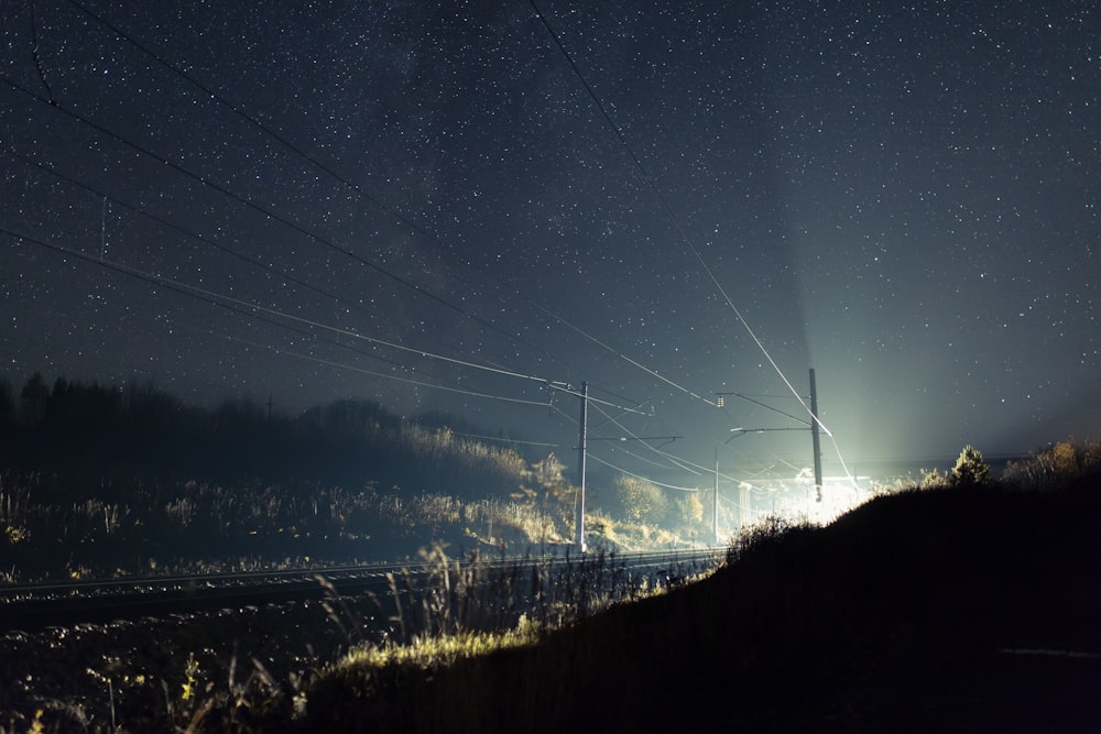 landscape photography of outdoor post lamp at night