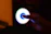 A futuristic scientist character in a glowing lab coat holding a spinning Beyblade with neon blue and gold highlights.