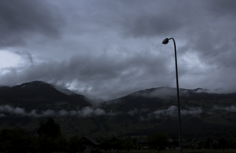 black post under cloudy sky