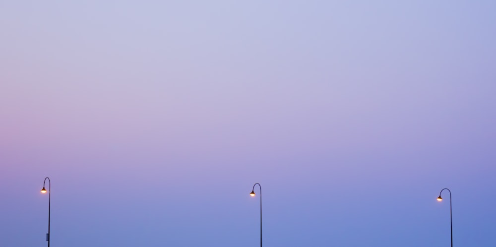 turned-on three light posts wallpaper