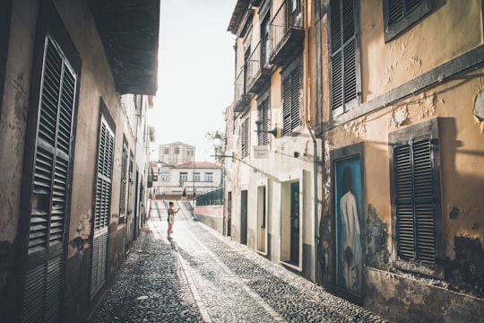 person standing on street outdoors in Funchal Portugal