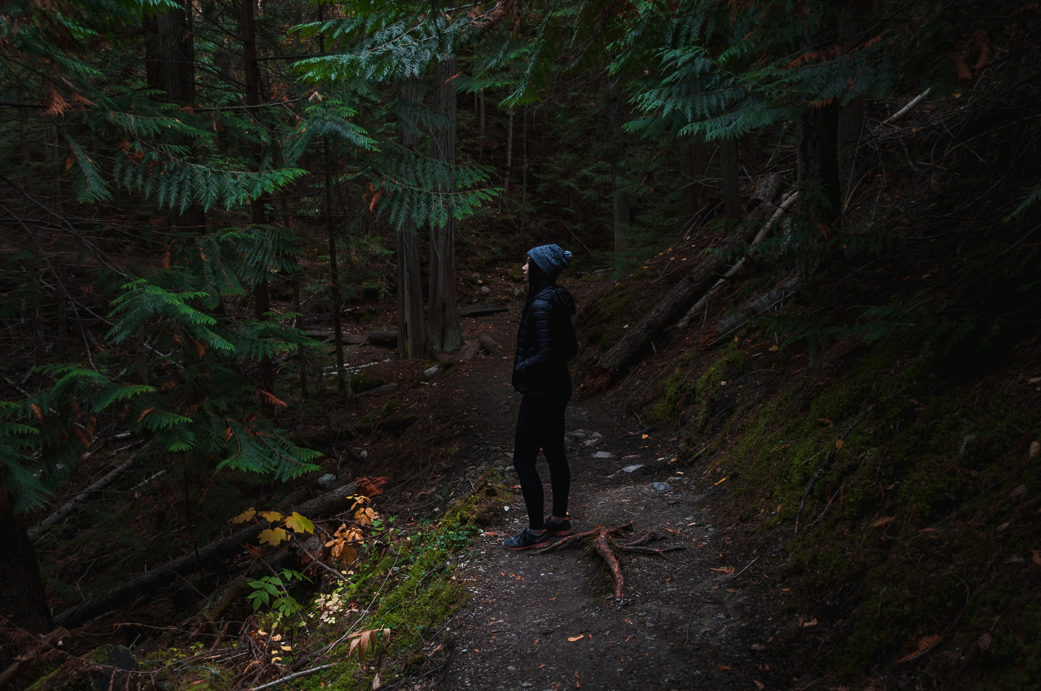 woman standing in woods