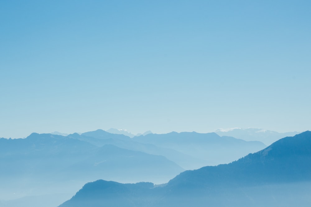 mountain range under clear blue sky