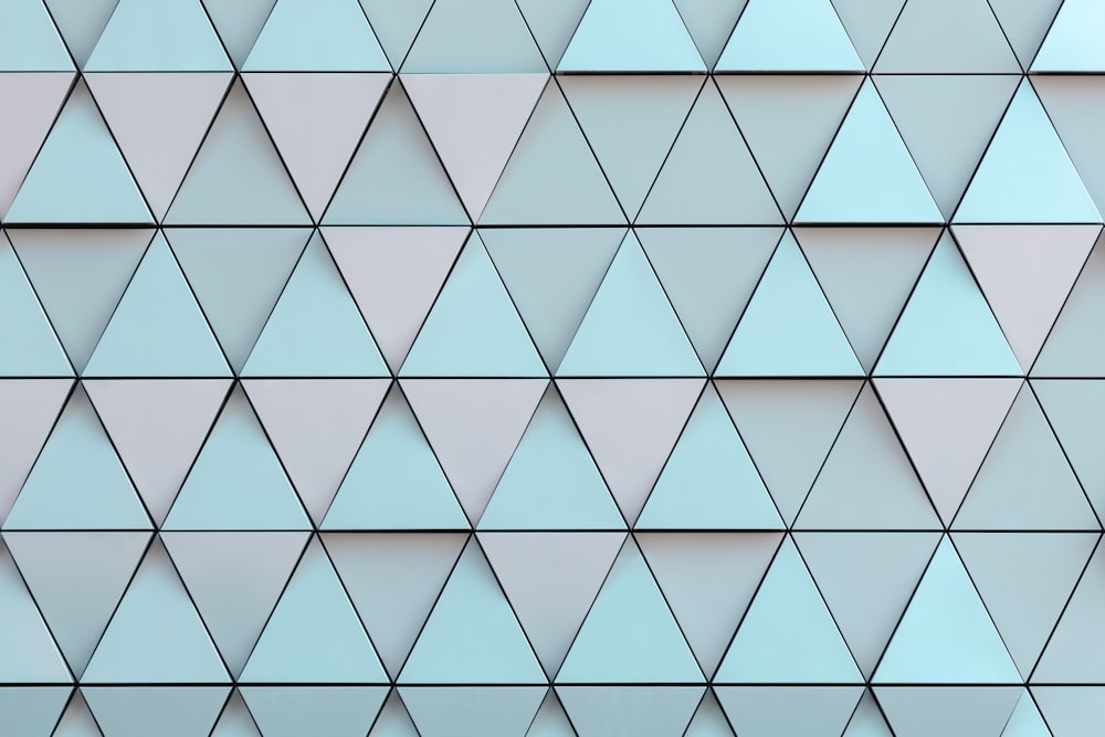 a close up of a wall made of triangles