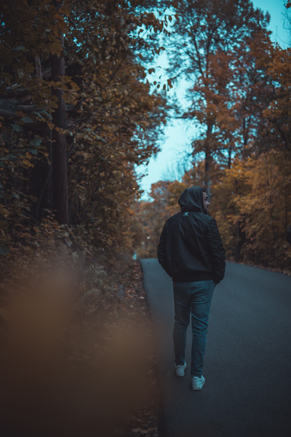 person standing on road