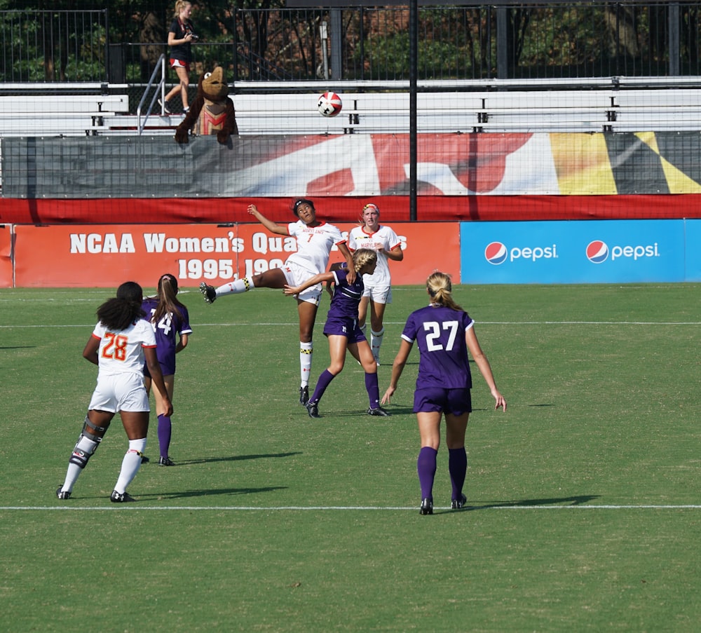 women playing football during daytime